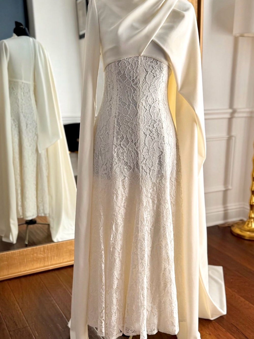 Elegant Ivory Lace Gown with Draped Cape - Picture 2 of 3